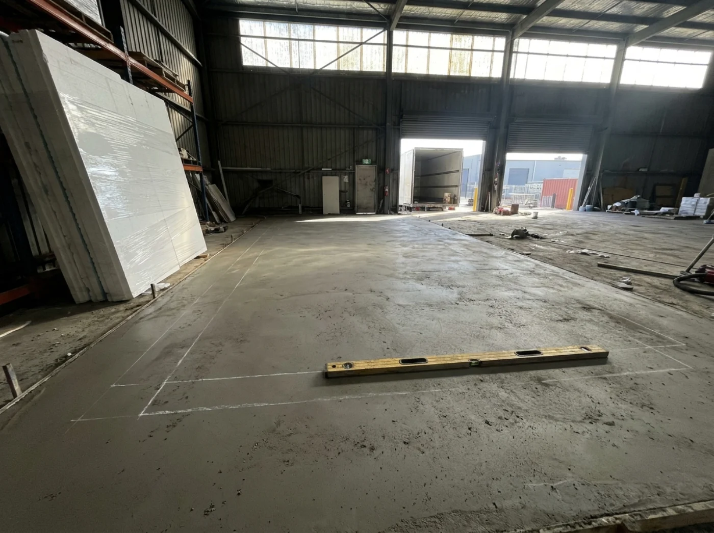 Level concrete slab marked out and prepared for a cool room installation